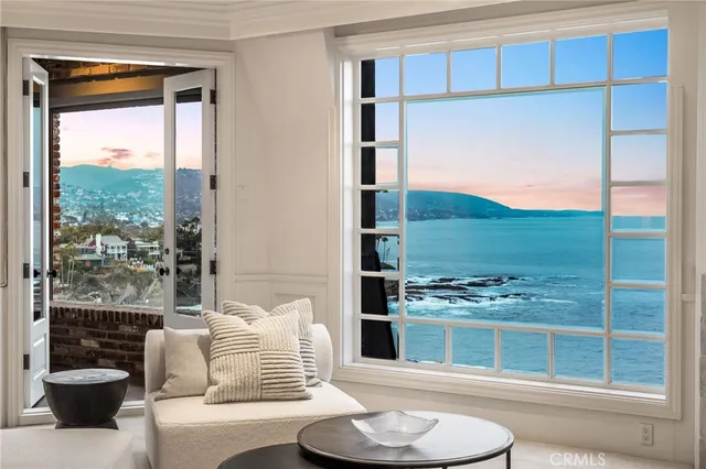 a spacious bathroom with a double vanity sink a mirror and a bathtub