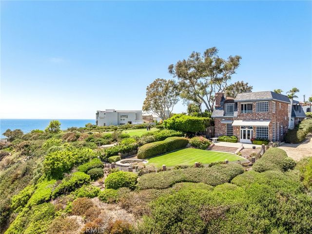 a view of a garden with a building in front of it