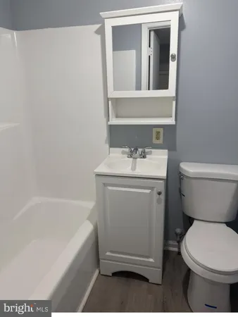 a bathroom with a sink toilet and bathtub