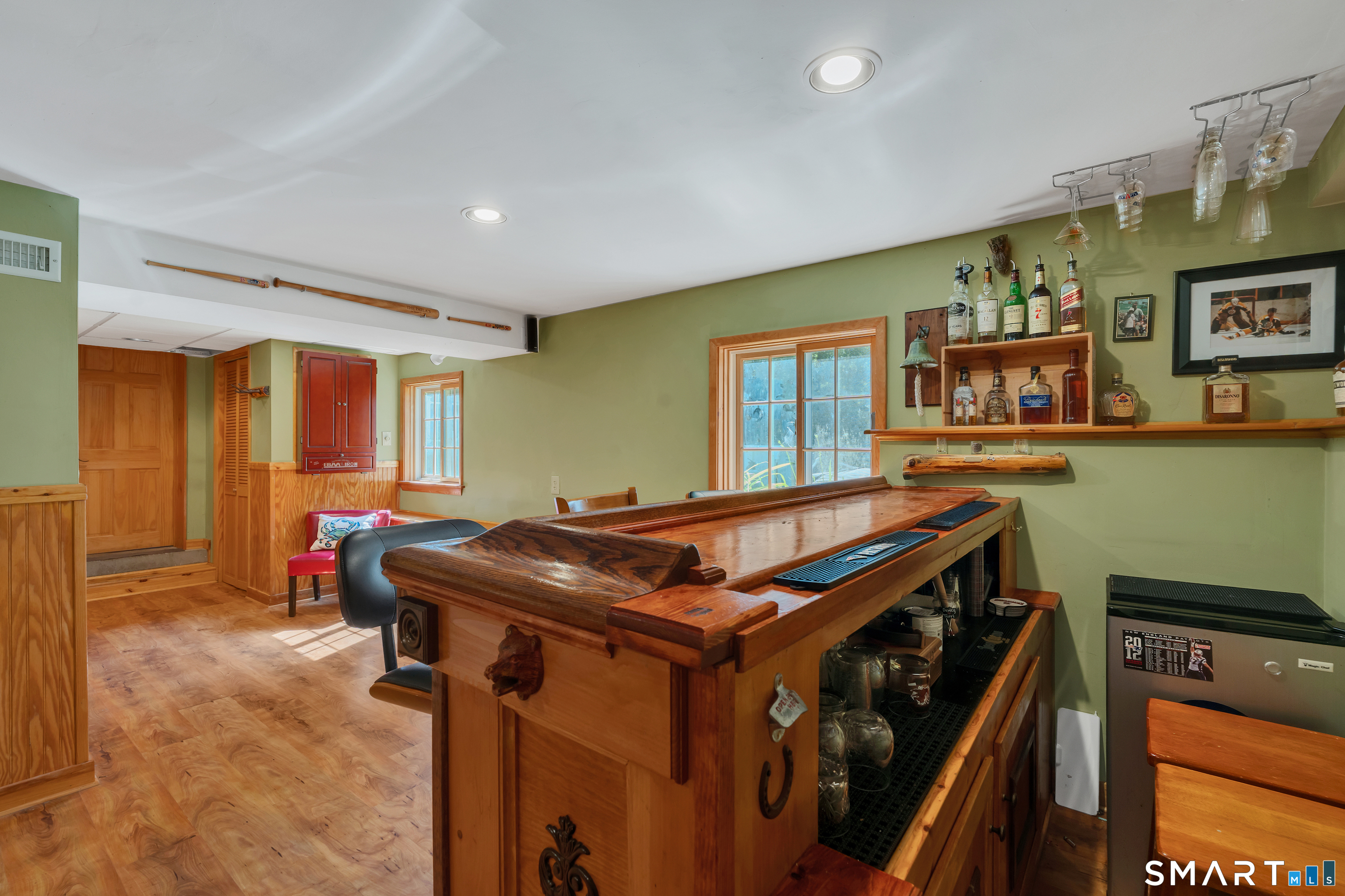 94 Warpas Road Madison, CT 06443 - Photo 16 of 28 Partially finished basement with custom bar