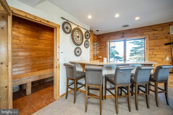 a bedroom with a large bed and a tv