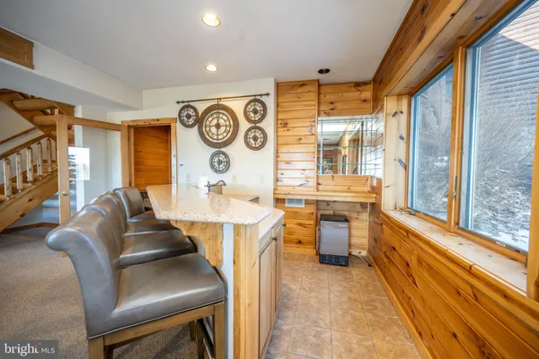 a bedroom with a bed and a tv