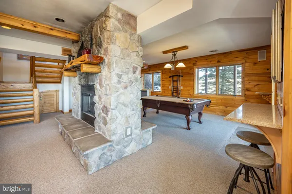 a bed room with a bed and a chandelier