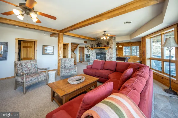 a bedroom with furniture and a window