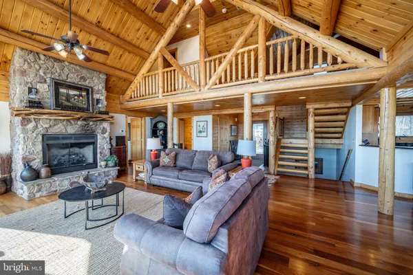 a kitchen with stainless steel appliances granite countertop a refrigerator a sink a stove and cabinets