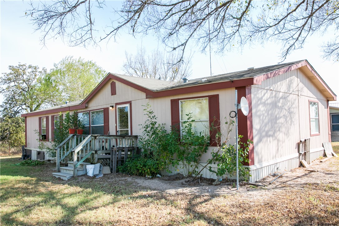 4254 FM 180 Road Ledbetter, TX 78946 - Photo 9 of 11 View of front of house with a front lawn
