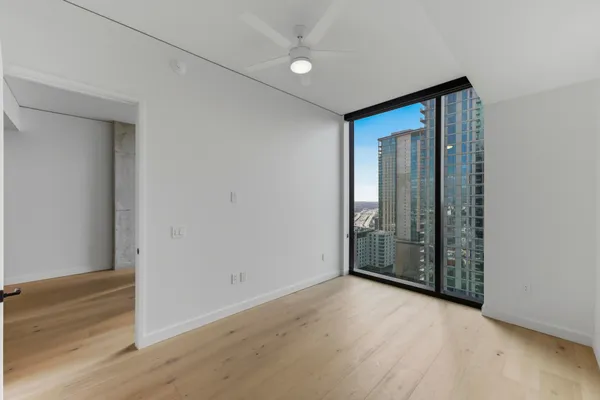 a bathroom with a shower and a glass door