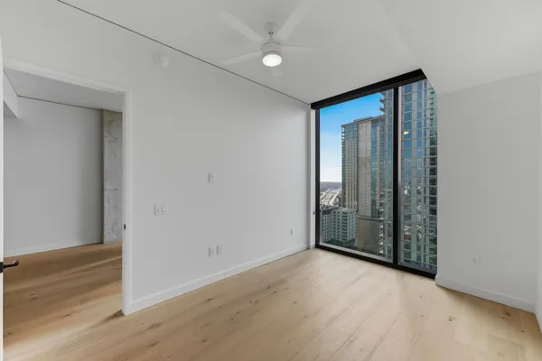 a bathroom with a shower and a glass door