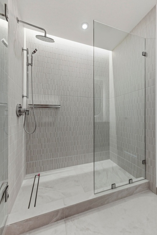 610 Davis Street, Unit 2204 Austin, TX 78701 - Photo 14 of 22 a bathroom with a shower and a glass door