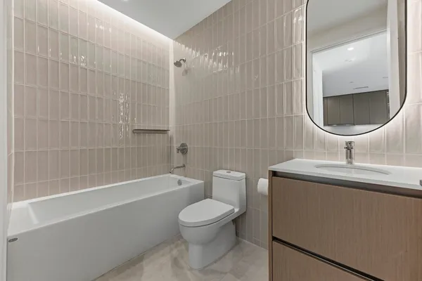 a bathroom with a bathtub and shower