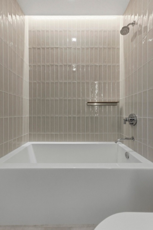 610 Davis Street, Unit 2204 Austin, TX 78701 - Photo 19 of 22 a bathroom with a bathtub and shower