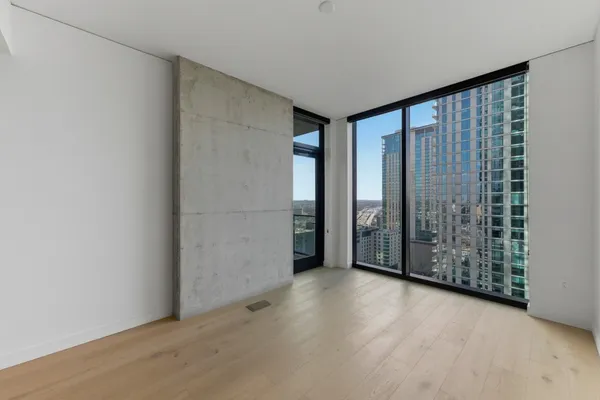 a view of a room with large windows