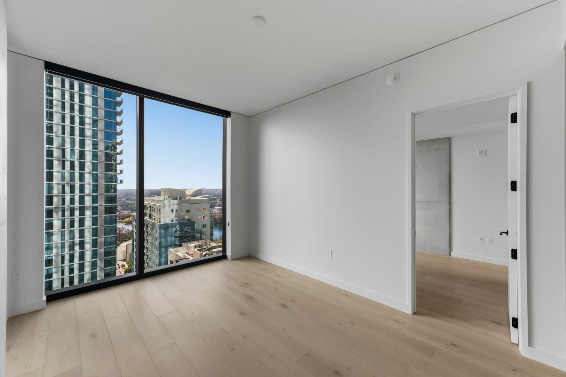 610 Davis Street, Unit 2204 Austin, TX 78701 - Photo 5 of 22 a view of a room with large windows