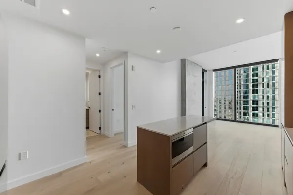 a kitchen with granite countertop a stove and a sink