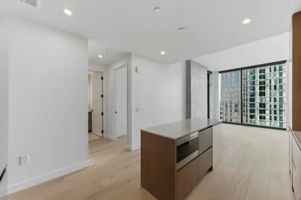 a kitchen with granite countertop a stove and a sink