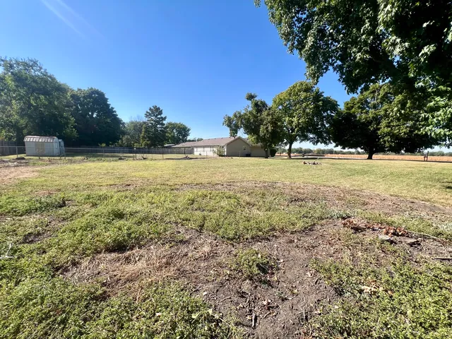 a view of a yard with an outdoor space