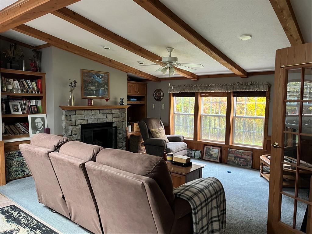 319 Farm Road New Bethlehem, PA 16242 - Photo 8 of 12 a living room with furniture large window and a flat screen tv