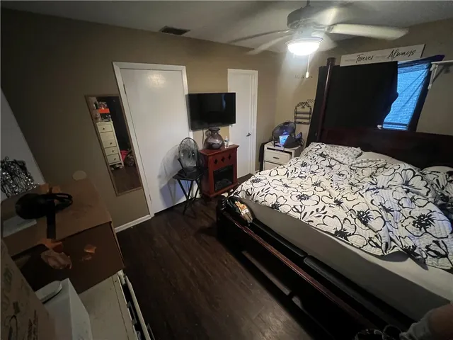 a bed room with a bed and a television