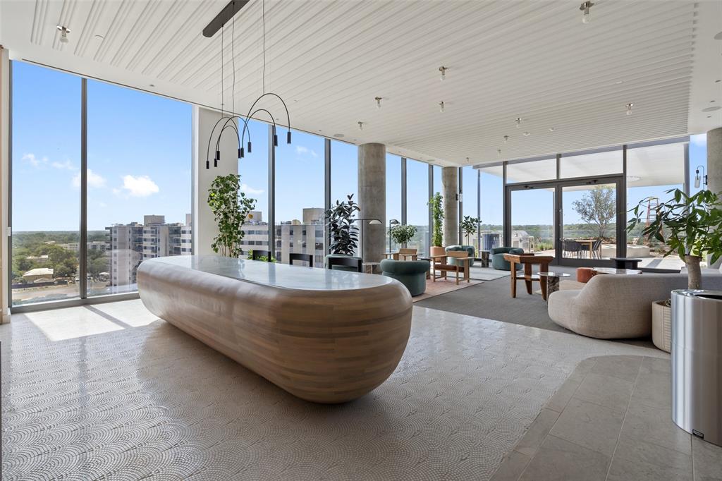 44 East Avenue, Unit 4402 Austin, TX 78701 - Photo 15 of 39 a living room with couches and a large window with balcony view