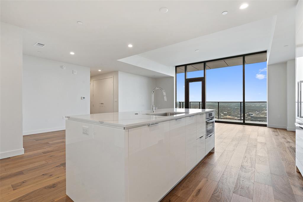 44 East Avenue, Unit 4402 Austin, TX 78701 - Photo 27 of 39 a large white kitchen with a large window