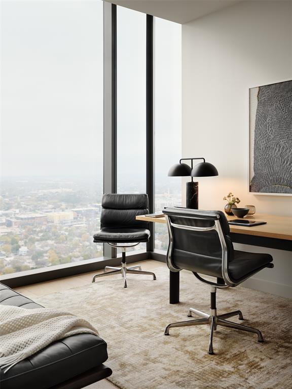 44 East Avenue, Unit 4402 Austin, TX 78701 - Photo 3 of 39 a room with a table and a flat screen tv