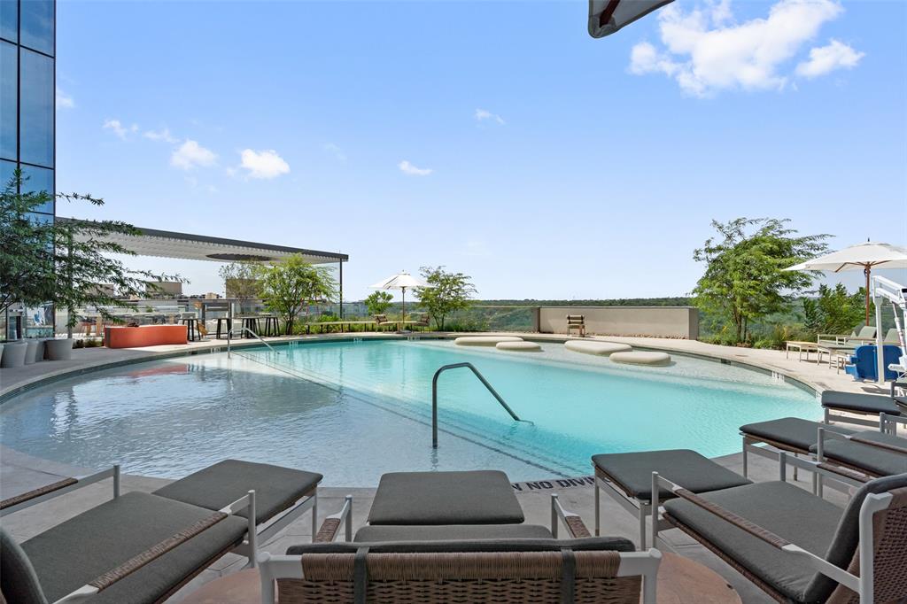 44 East Avenue, Unit 4402 Austin, TX 78701 - Photo 7 of 39 a view of a swimming pool and outdoor seating