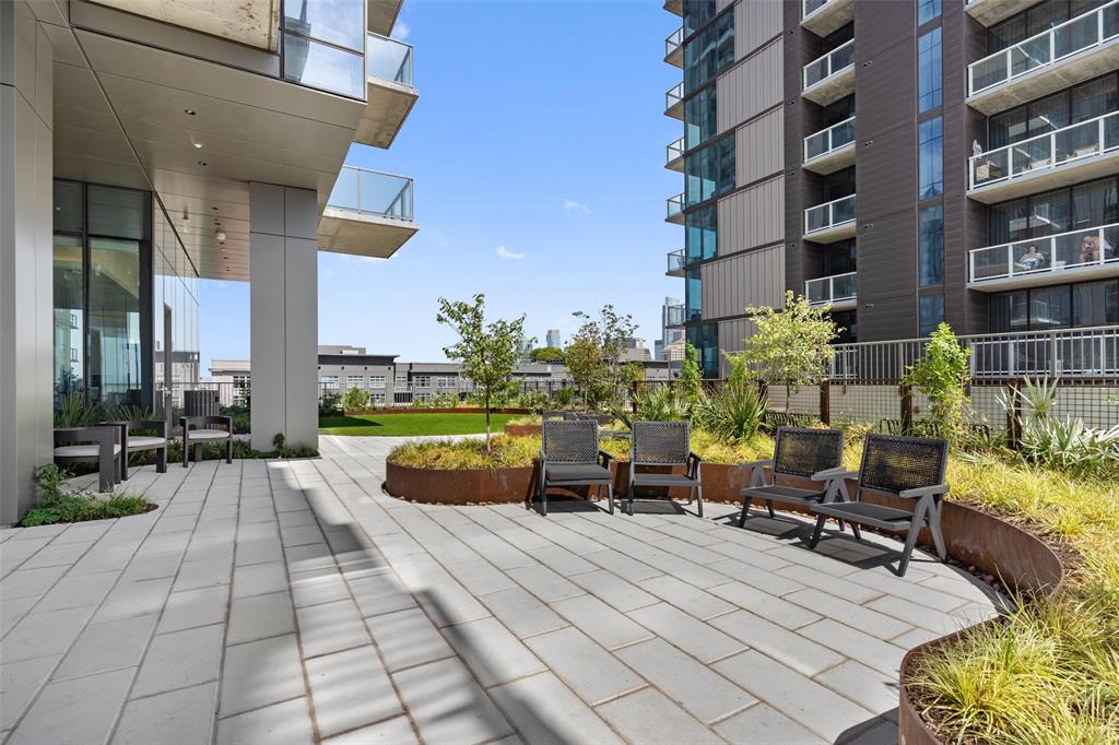 44 East Avenue, Unit 4402 Austin, TX 78701 - Photo 8 of 39 a view of a patio with couches and a potted plant on a table