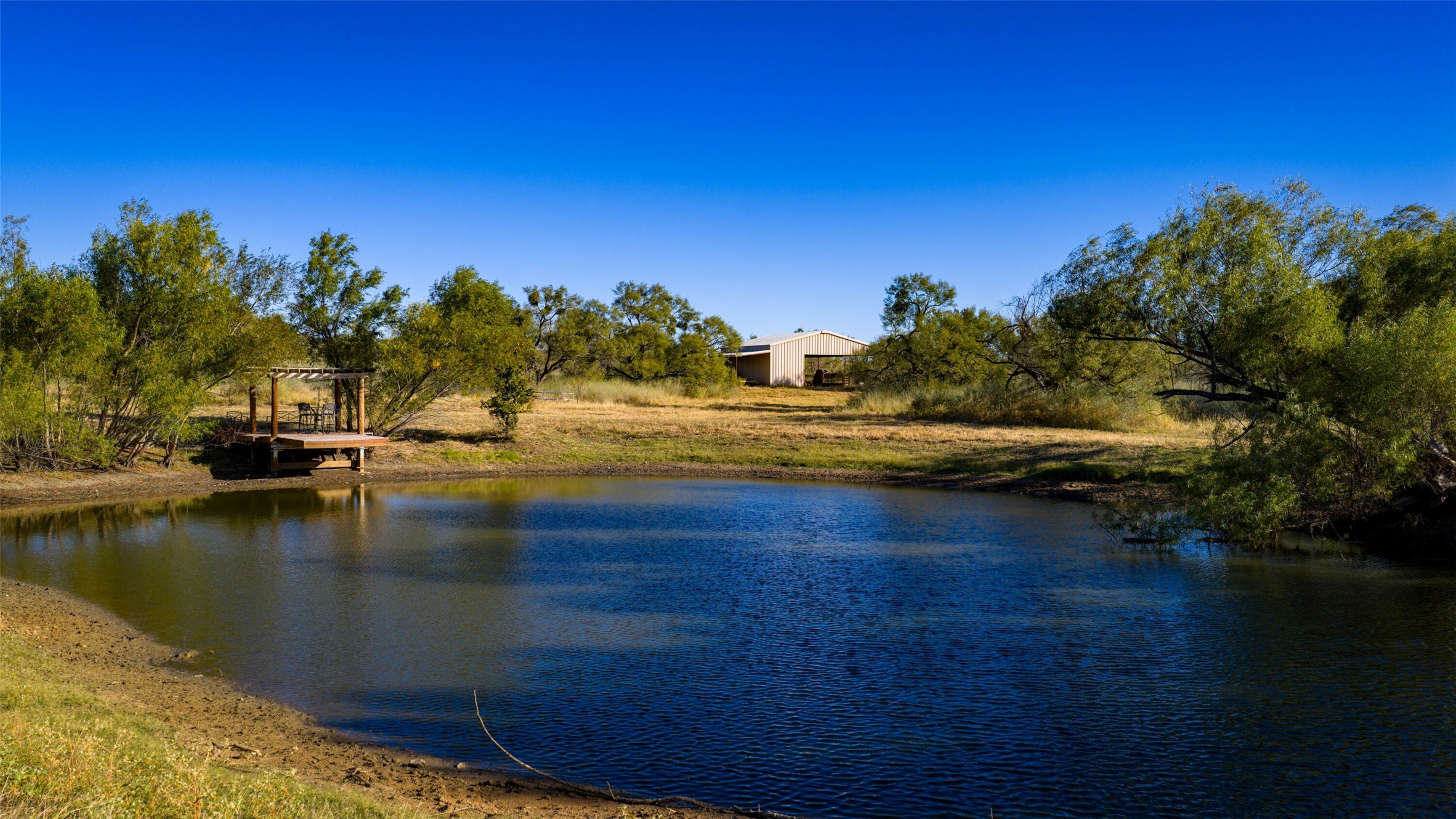 7702 Ranch Road 965 Llano, TX 78643 - Photo 31 of 40 a view of a lake with houses