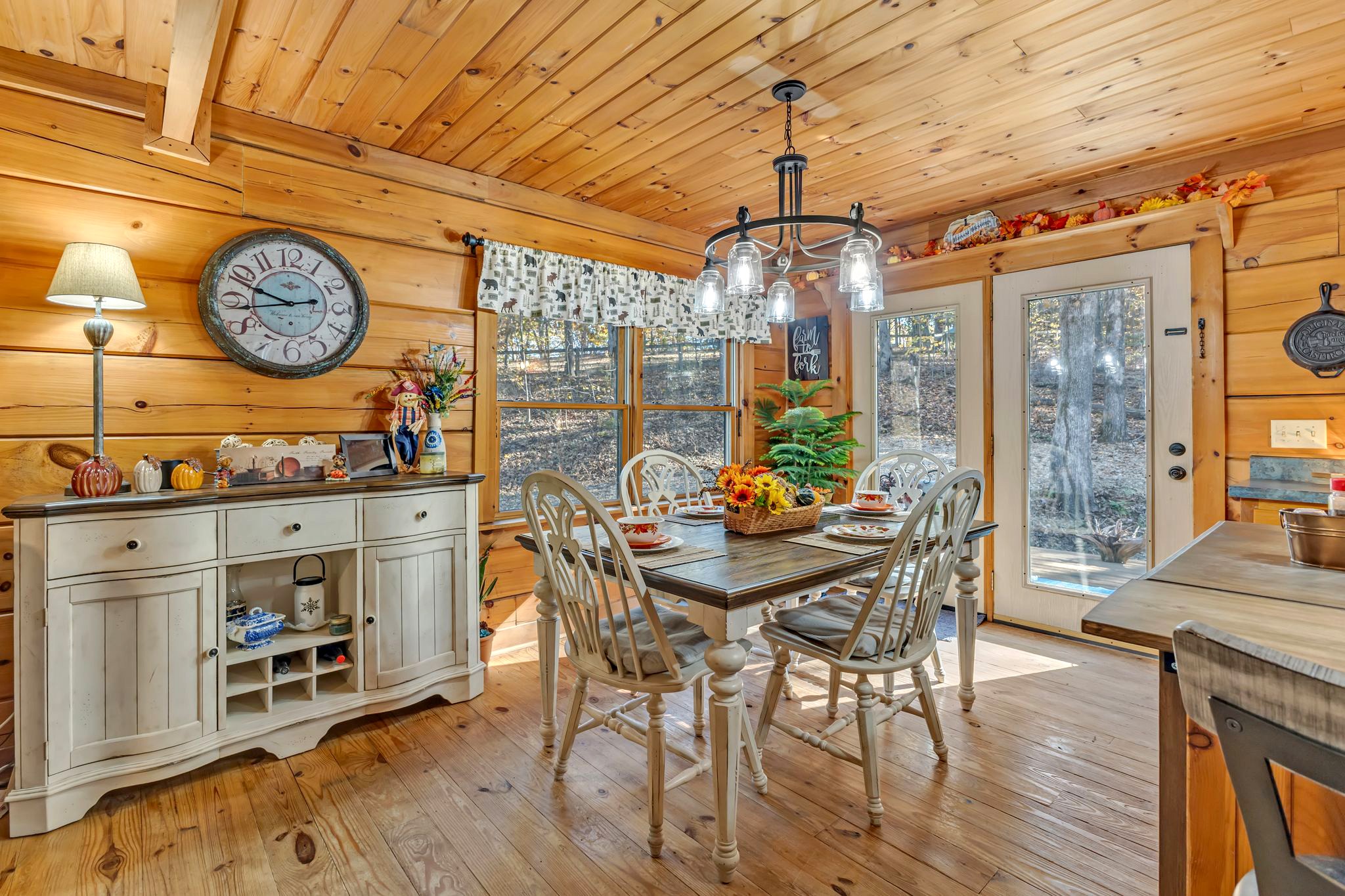 5833 Dewey Carr Road Bethpage, TN 37022 - Photo 19 of 60 a view of a dining room and livingroom with furniture wooden floor and a chandelier