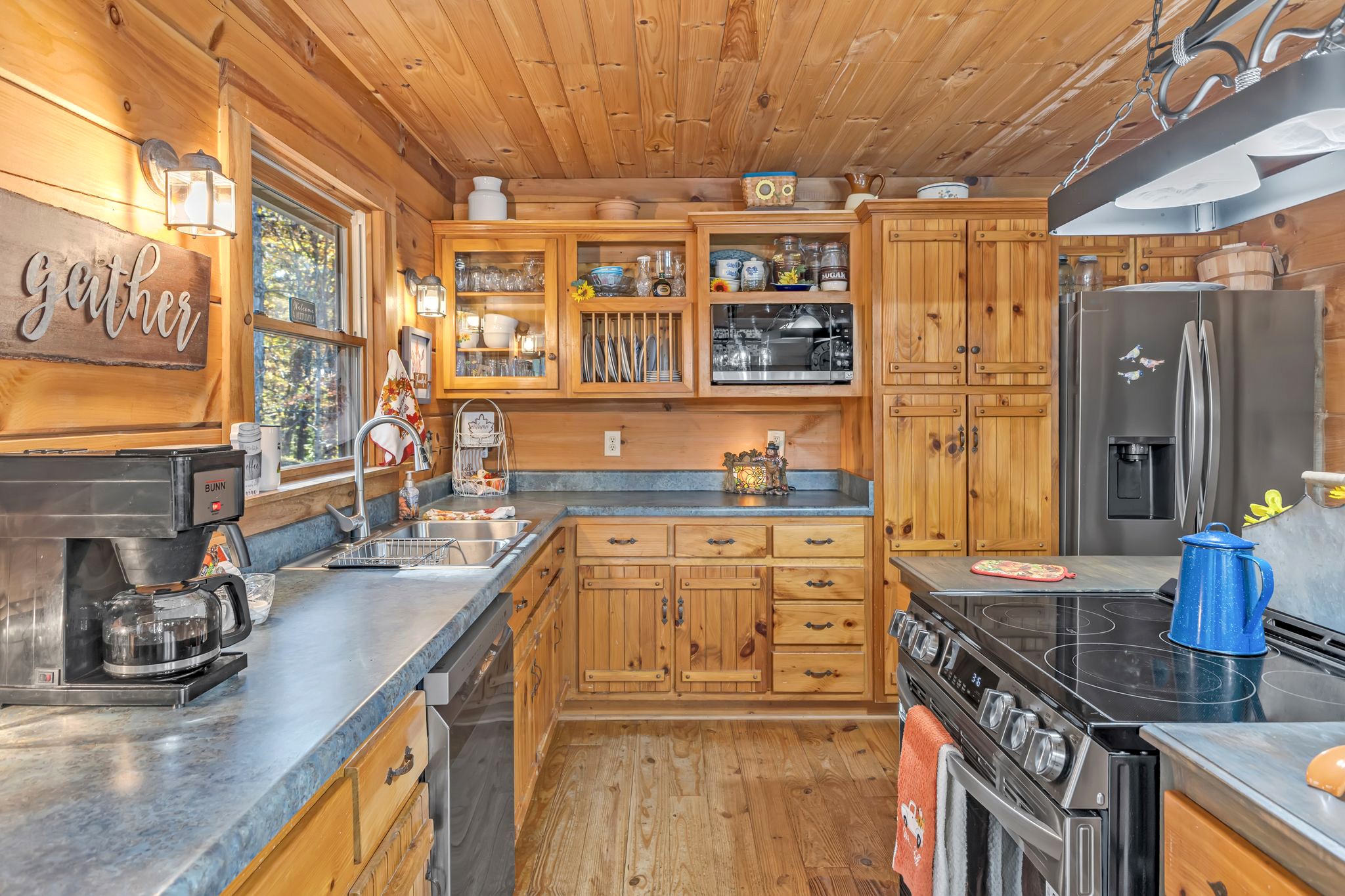 5833 Dewey Carr Road Bethpage, TN 37022 - Photo 22 of 60 a kitchen with stainless steel appliances sink stove and cabinets
