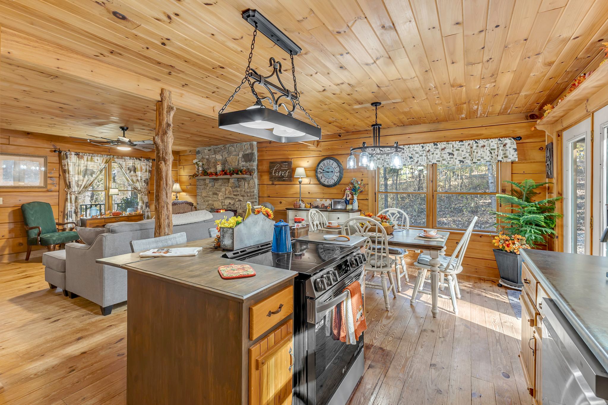 5833 Dewey Carr Road Bethpage, TN 37022 - Photo 24 of 60 a view of a dining room with furniture wooden floor and chandelier