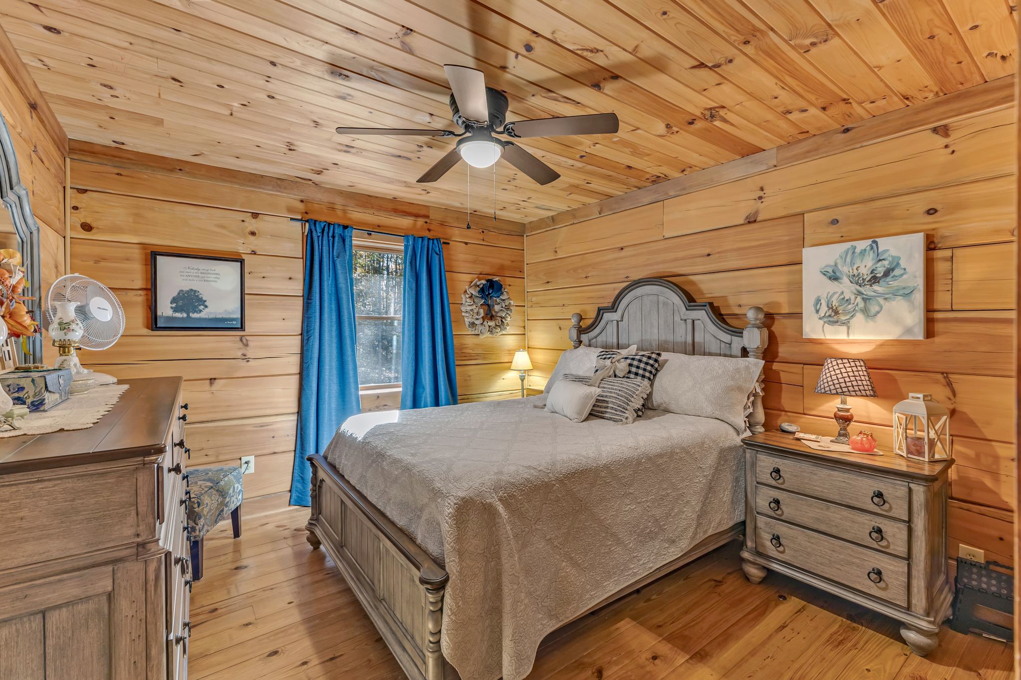 5833 Dewey Carr Road Bethpage, TN 37022 - Photo 27 of 60 a bedroom with a bed and a chandelier