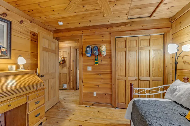 a bedroom with a bed and a dresser