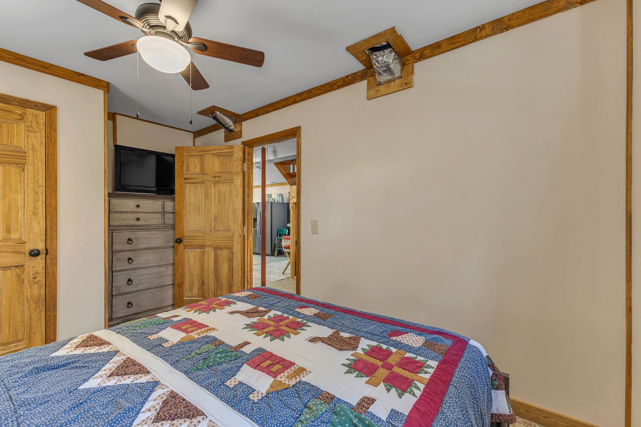 5833 Dewey Carr Road Bethpage, TN 37022 - Photo 39 of 60 a bedroom with a bed and a dresser