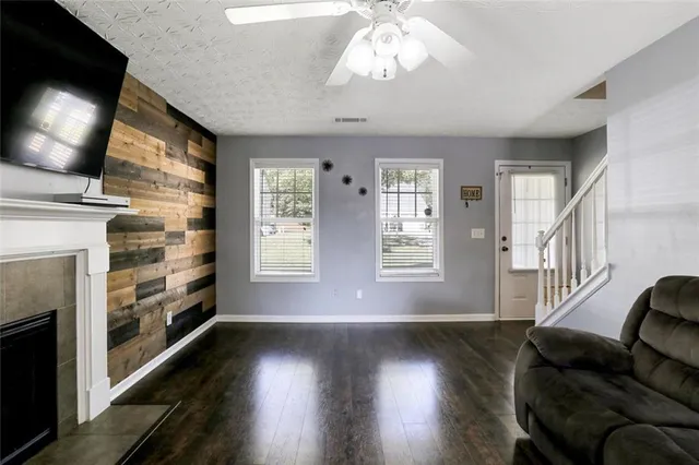 a view of livingroom with furniture wooden floor and window
