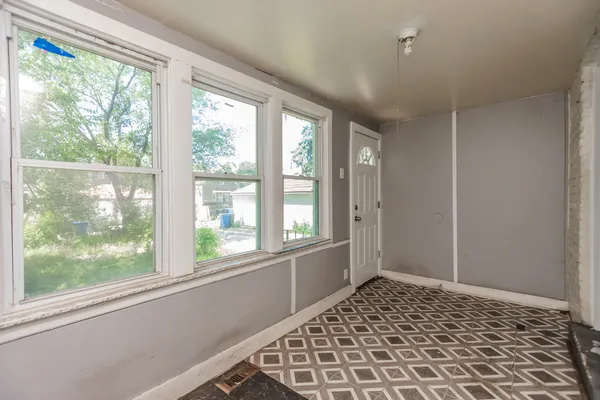 a view of an empty room and window