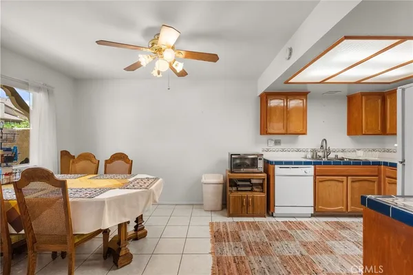 a kitchen with stainless steel appliances granite countertop a refrigerator sink and stove