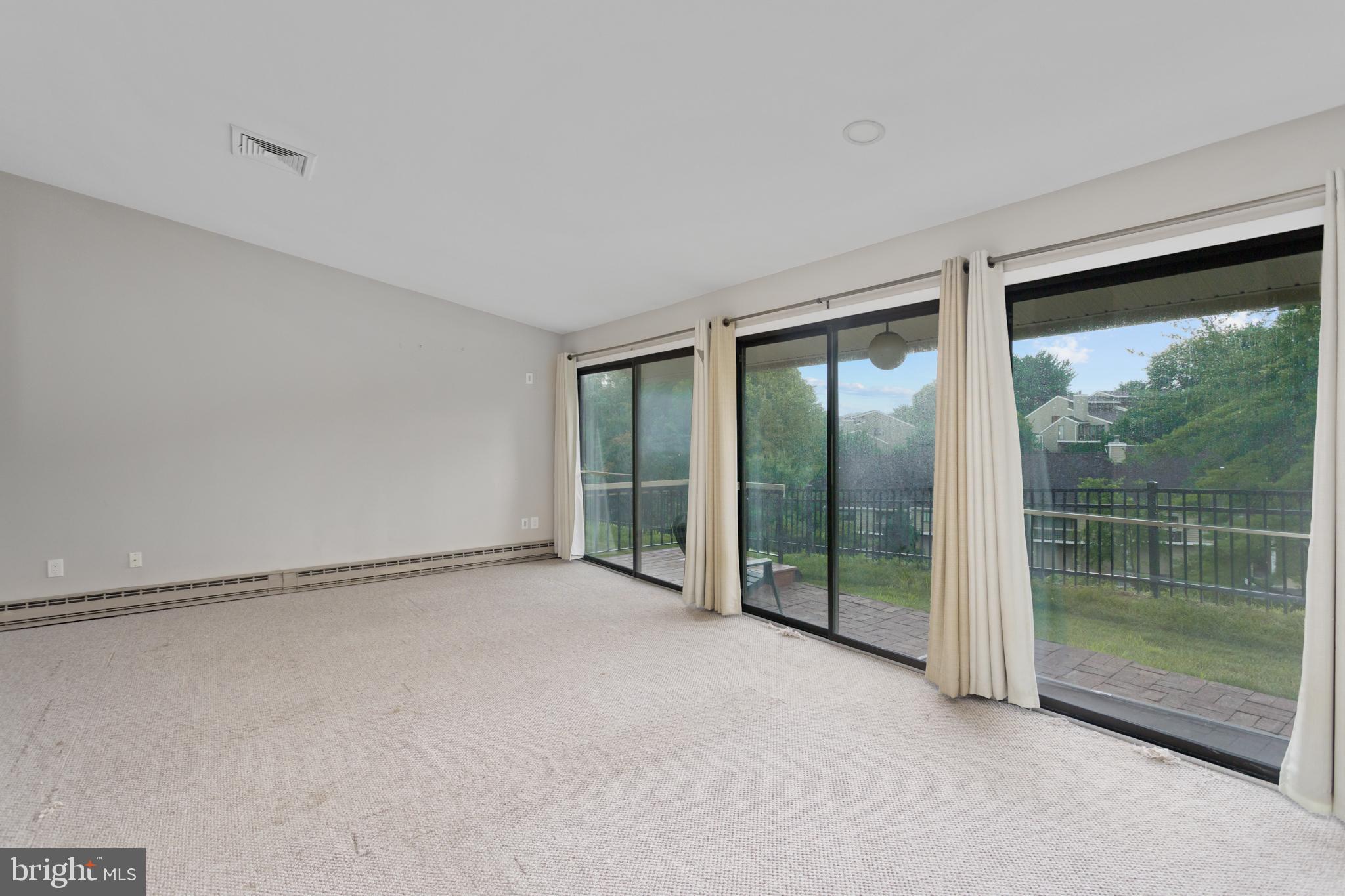41 Overlook Drive Clinton, NJ 08809 - Photo 13 of 24 a view of an empty room with glass door