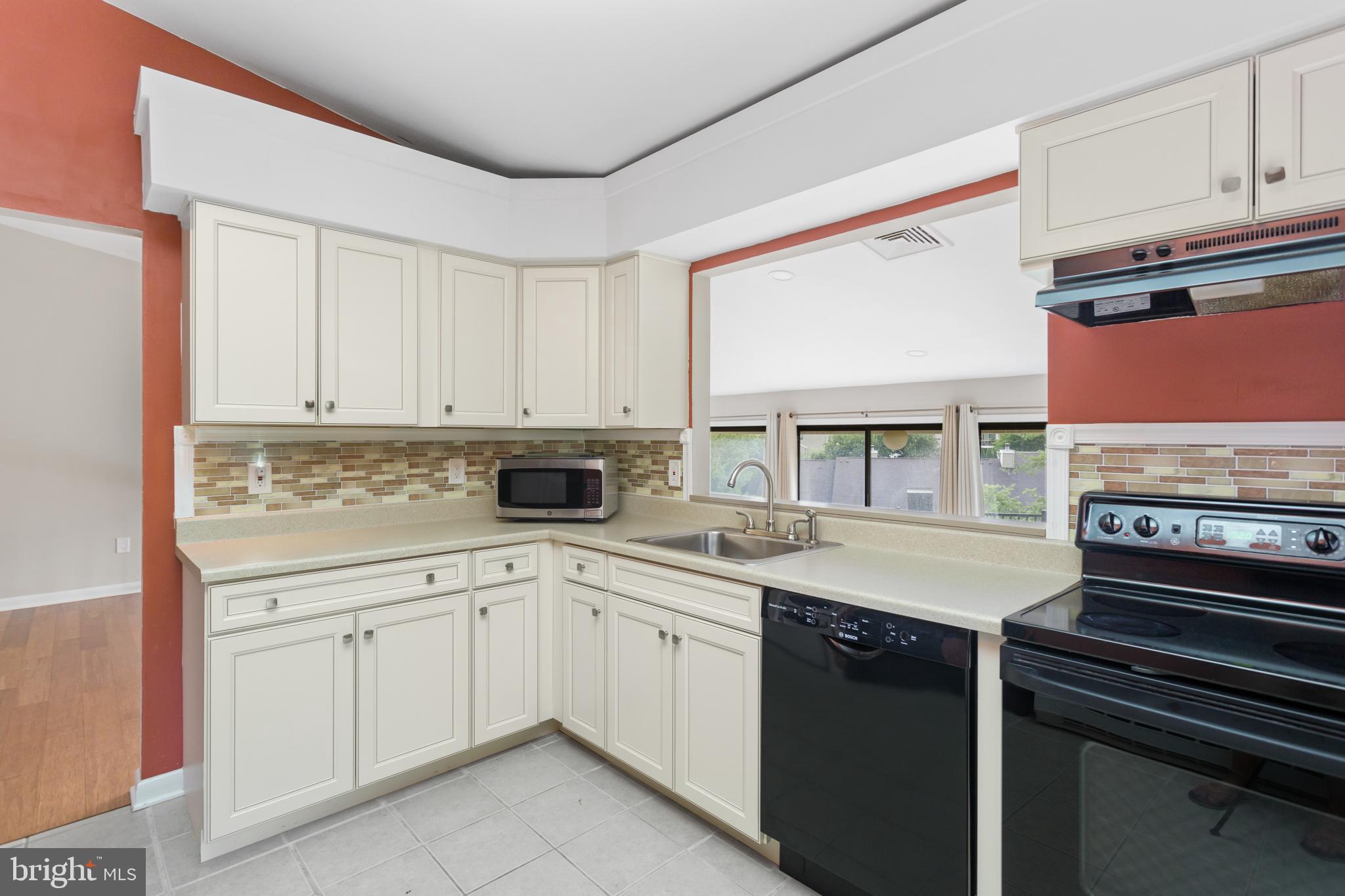 41 Overlook Drive Clinton, NJ 08809 - Photo 15 of 24 a kitchen with a sink stove and cabinets