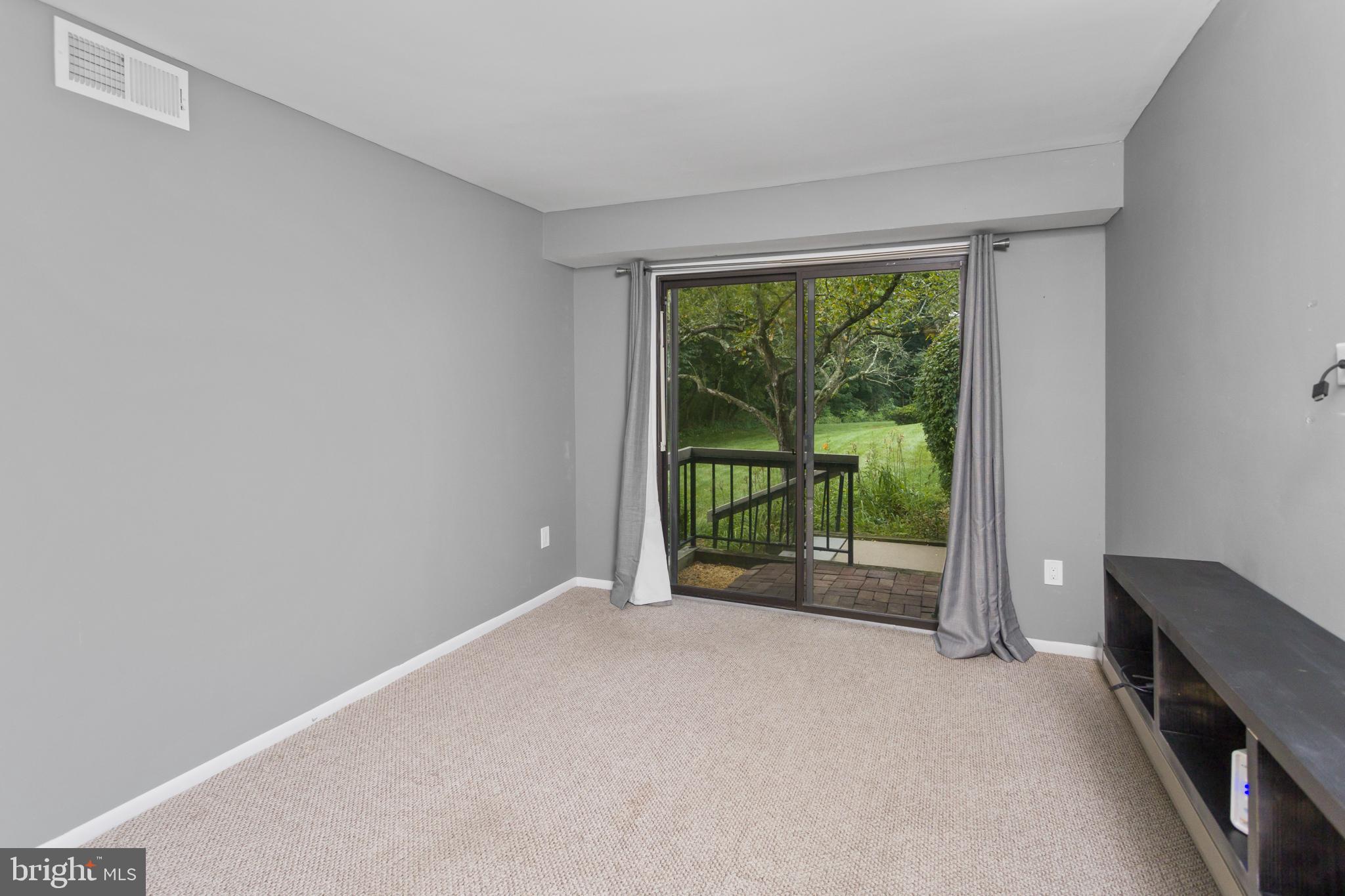 41 Overlook Drive Clinton, NJ 08809 - Photo 20 of 24 a view of an empty room with wooden floor and a sliding door