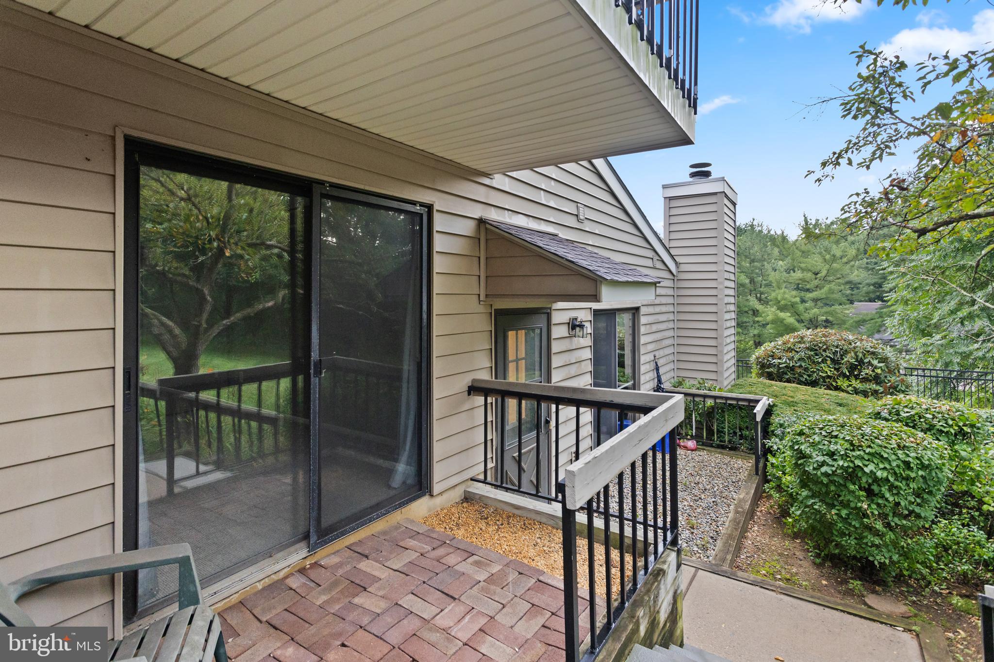 41 Overlook Drive Clinton, NJ 08809 - Photo 6 of 24 a view of balcony with floor to ceiling window and wooden fence