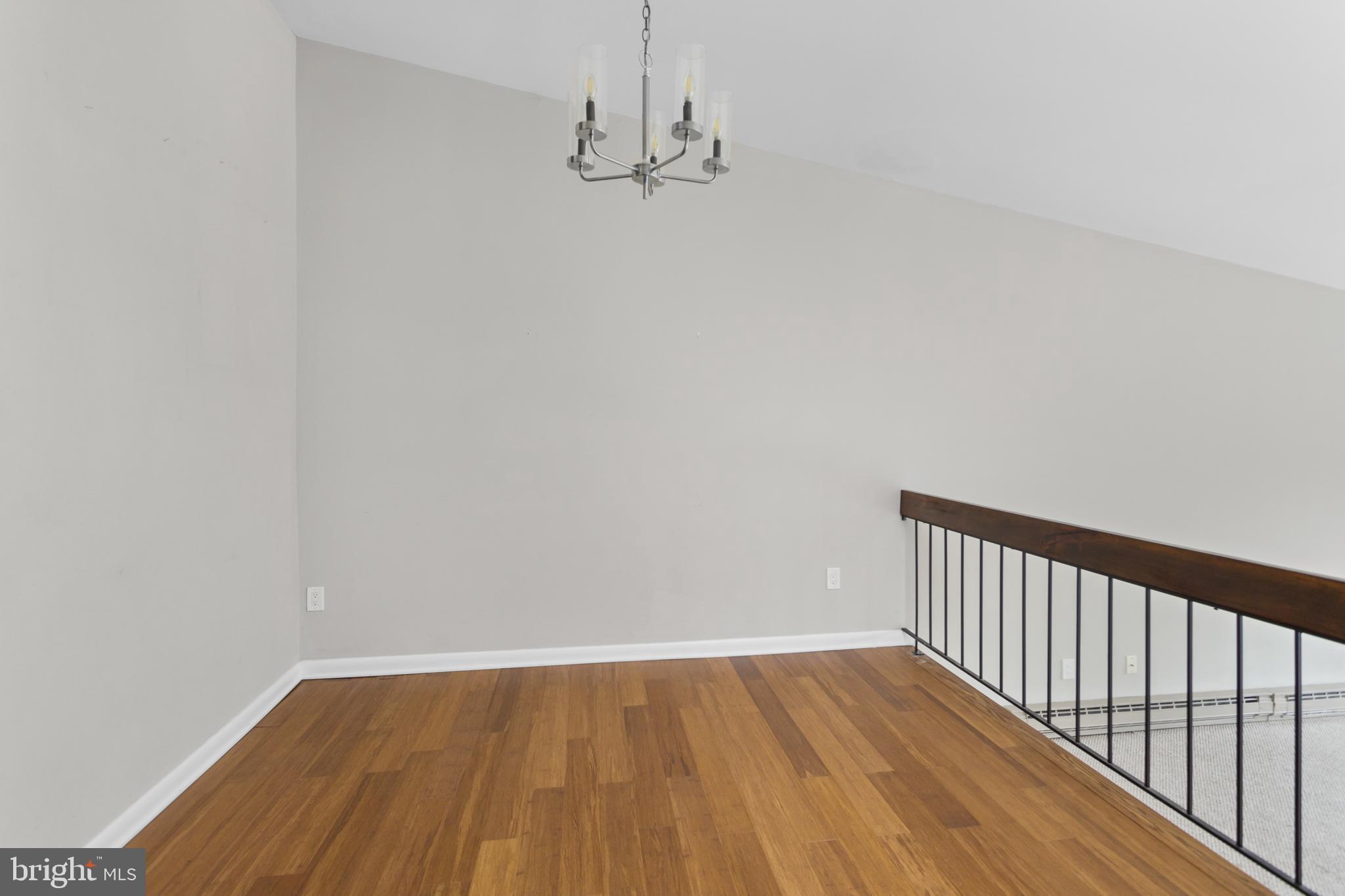 41 Overlook Drive Clinton, NJ 08809 - Photo 8 of 24 a view of a hallway with wooden floor and a chandelier
