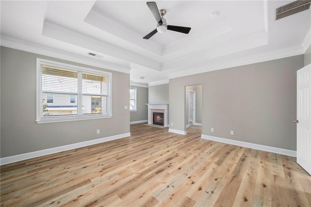 3628 Ashcroft Bend Atlanta, GA 30319 - Photo 24 of 44 a view of empty room with wooden floor and fan