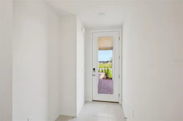 a view of an entryway with wooden floor