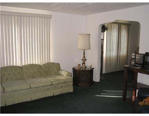 4314 Highgrove Road Whitehall, PA 15234 - Photo 5 of 8 Living Room. The living room opens to the separate dining room through the arched doorway.