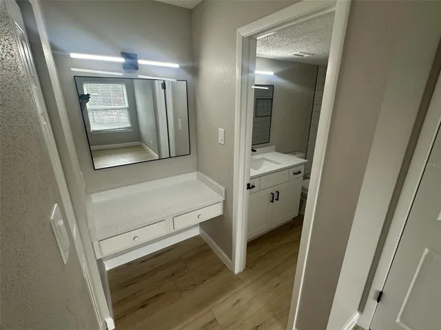 a view of a bathroom from a hallway