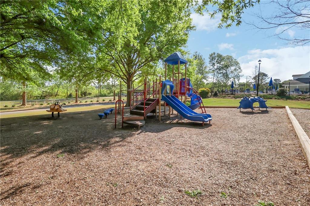 6259 Spring Lake Drive Flowery Branch, GA 30542 - Photo 32 of 35 a view of outdoor space with playground and green space