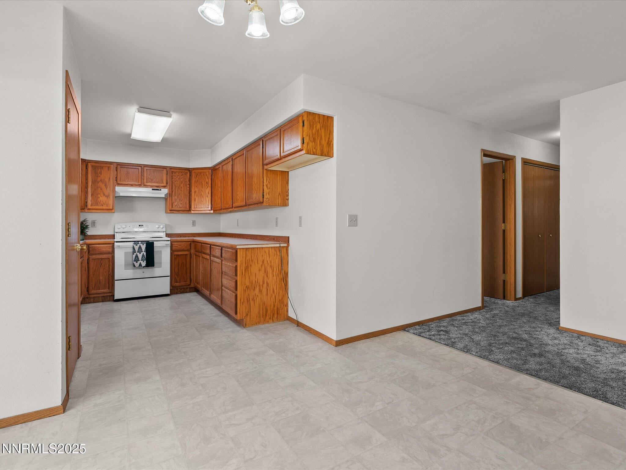 1951 Albert Street Fallon, NV 89406 - Photo 11 of 36 a view of a kitchen with a sink stove and a refrigerator