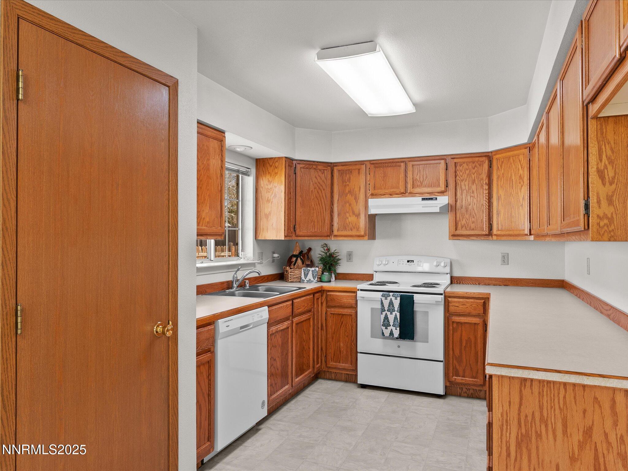 1951 Albert Street Fallon, NV 89406 - Photo 12 of 36 a kitchen with stainless steel appliances granite countertop a stove a sink dishwasher and a refrigerator