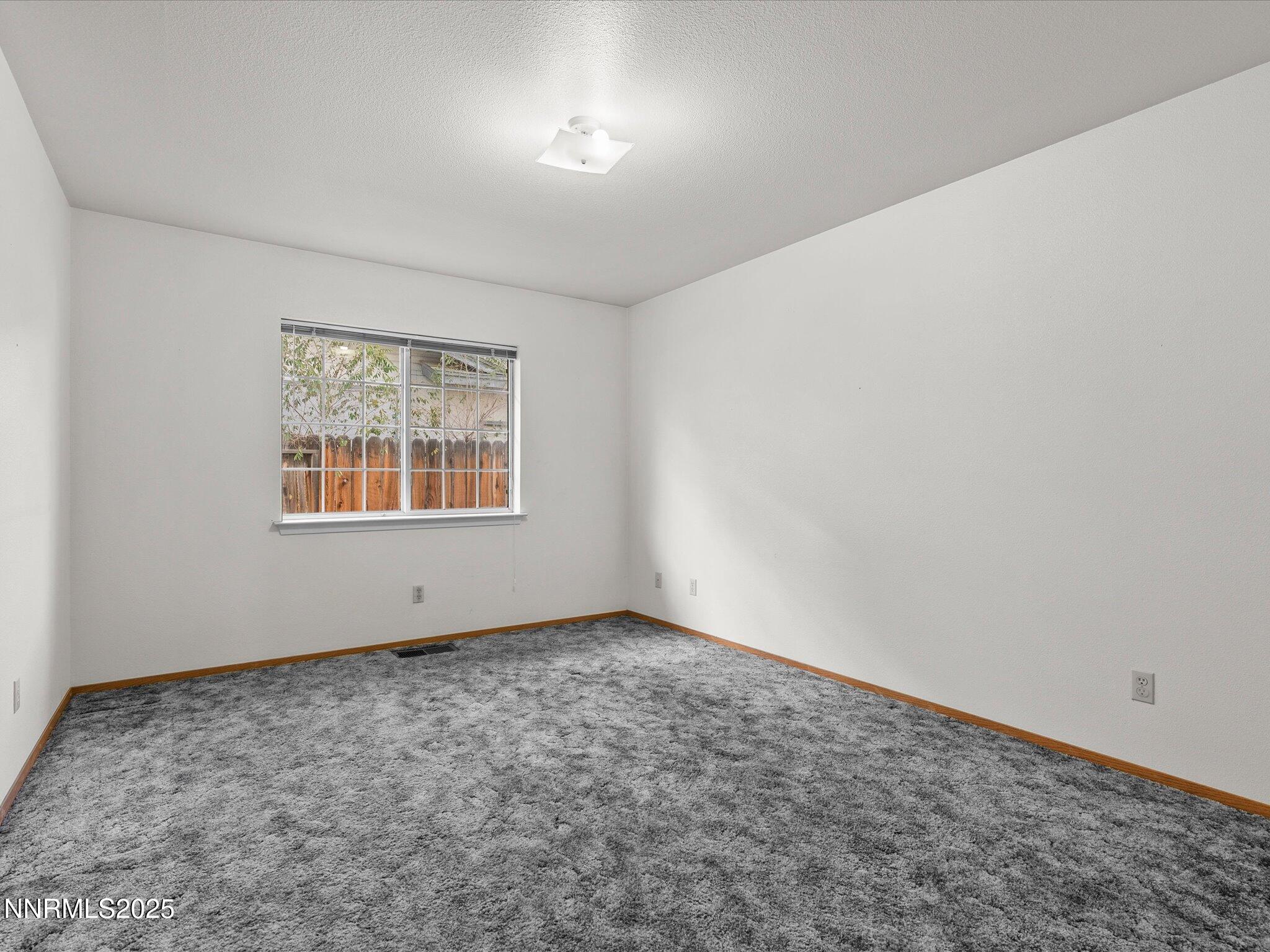 1951 Albert Street Fallon, NV 89406 - Photo 16 of 36 an empty room with a window